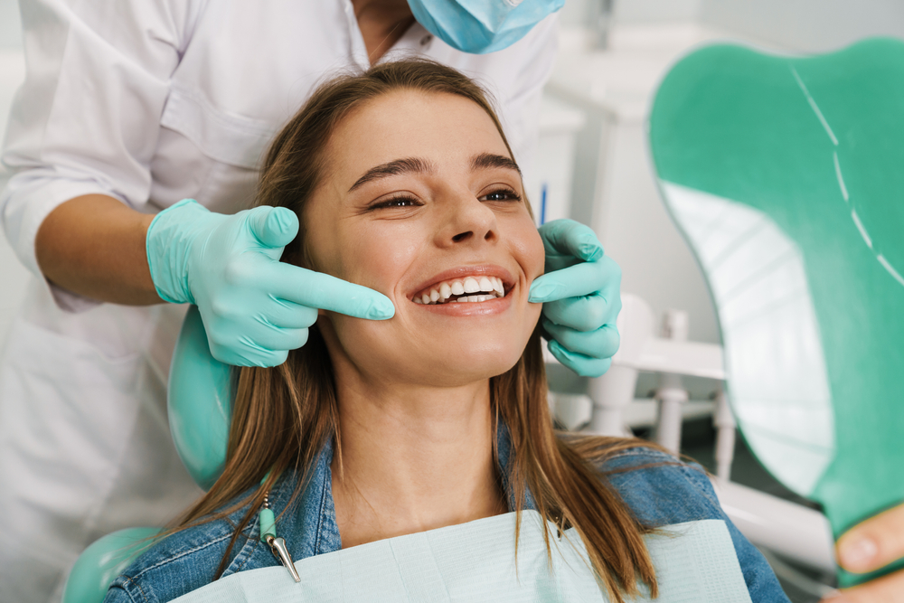 Smile Evaluation Before Dental Implant Treatment – Austin TX Dental Implants Dental professional assessing a patient’s smile before implant treatment, highlighting expert planning for long-lasting tooth replacement – Austin TX Dental Implants