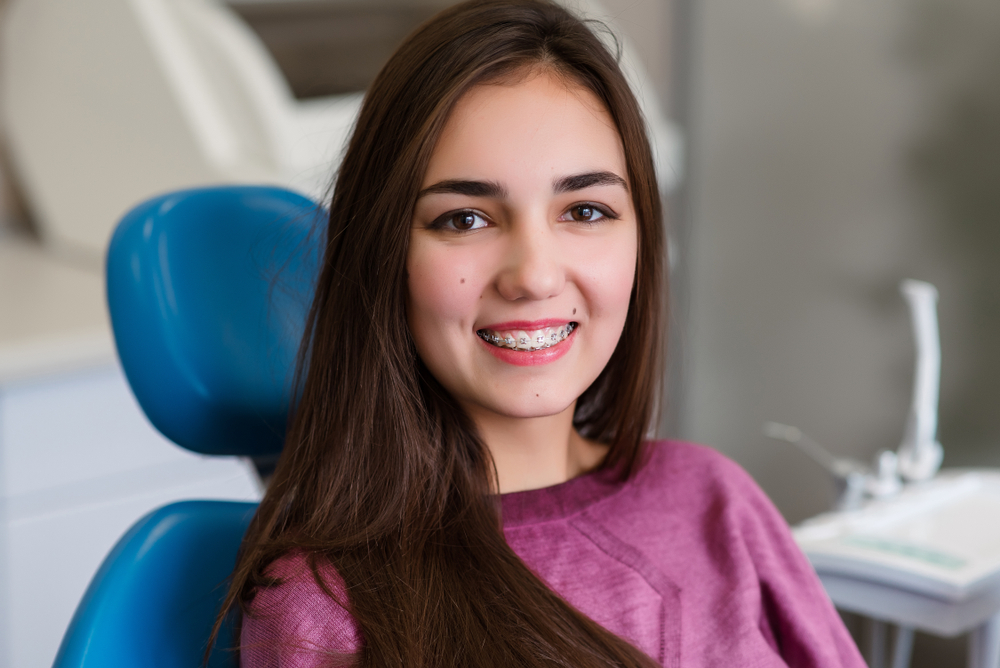 Patient displaying a confident smile after All-on-X treatment, reflecting long-lasting tooth replacement and full mouth restoration success - All on X & Full Mouth Rehabilitation